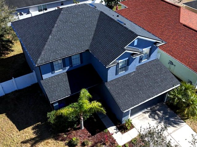 Aerial view of the completed black roof