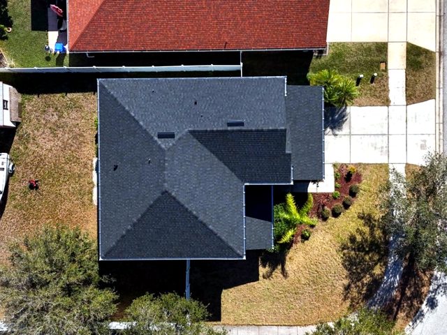 Finished charcoal hip roof from above