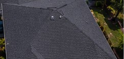 Storm-damaged asphalt shingle roof replaced in Orlando after