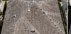 Weathered shingle roof restored after storm in Kissimmee before